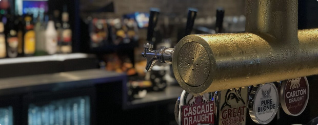 Quench your thirst at The Boardwalk Bar with a selection of beers on tap, including local favorites like Cascade Draught and Great Northern.