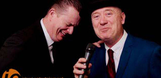 Two comedians sharing a laugh on stage at Wrest Point.